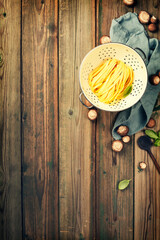 Cooking background with fresh pasta tagliatelle and mushrooms flat lay