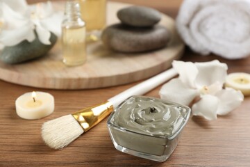 Composition with cosmetic product for spa body wraps on wooden background
