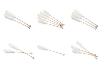 Set of wooden sticks with sugar crystals on white background. Tasty rock candies