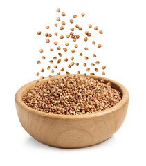 Raw buckwheat grains falling in bowl on white background