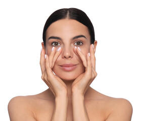 Beautiful young woman touching skin around eyes on white background
