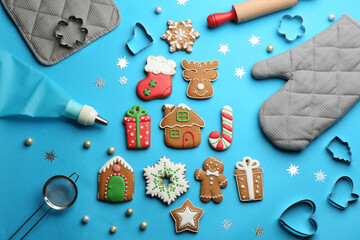 Flat lay composition with delicious gingerbread cookies and kitchen items on light blue background - Powered by Adobe