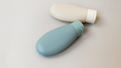 Set of travel reusable cosmetic bottle. Zero waste beauty product. Concept of vacation toiletries. Environment care. High angle view.