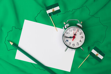 It is the time of Andalusia, community of southern Spain. Andalusian flag background with a note, a...