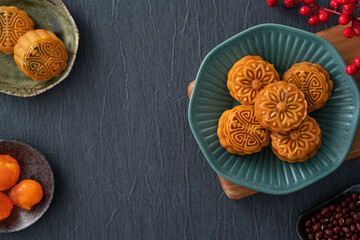 Delicious Cantonese moon cake for Mid-Autumn Festival food mooncake on blue table background.