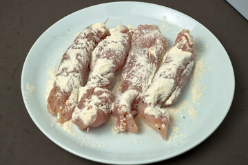 Turkey. Turkey rolls in flour, ready to fry