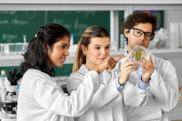 science research, gene technology and people concept - international group of scientists with green...
