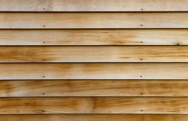 Horizontal rows of cedar wood siding as an exterior wall