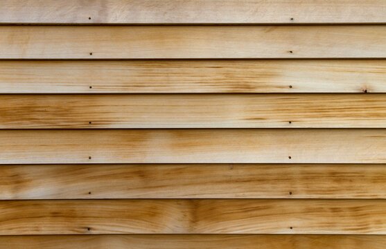 Horizontal rows of cedar wood siding as an exterior wall