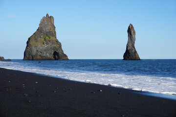 Fototapeta na wymiar Two rocks at Reynisfjara Black Beach in Iceland