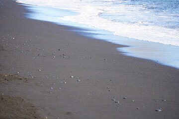 Reynisfjara - black beach in Iceland, close-up on waves