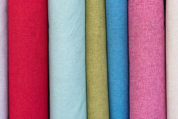 A set of samples of fabric furniture decoration lines of textile textures. Multicolored stripes upholstery. Mode and tone for a luxurious interior style.