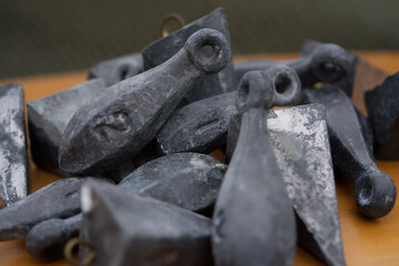 A close up of fishing sinkers.