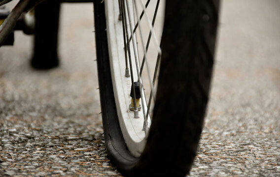 Bike Flat Tire On Pavement, Soft And Selective Focus.