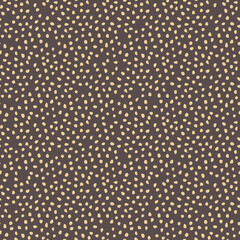 Seamless background with golden random elements. Abstract brown and golden ornament. Dotted abstract pattern