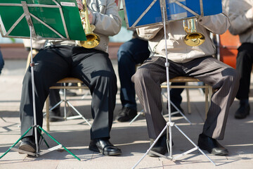 Hands musician plays musical instruments in orchestra