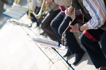 Hands musician plays musical instruments in orchestra