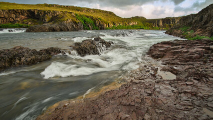 Naklejka na ściany i meble Rapids and waterfalls on the river at Fossatun near Borganes and Husafell, Western Iceland,