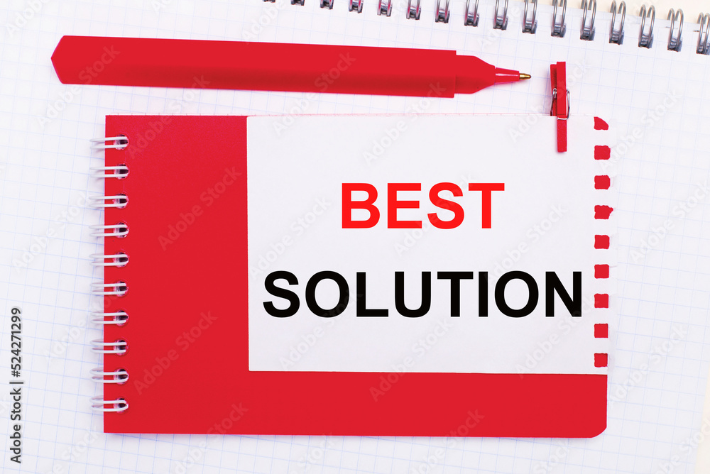 Poster on a white notepad, a red pen, a red notepad and a white sheet of paper with the text best solution