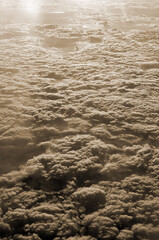 White fluffy clouds in the blue sky. Photos of clouds from the passenger liner porthole. Flight from Kiev to Sharm El Sheikh, Egypt.