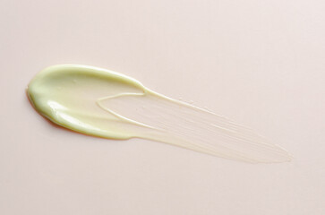 A sample of moisturizer on a pink background. Cosmetic product for the skin.