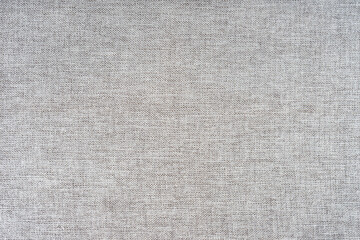 Texture of natural gray upholstery fabric or cloth. Fabric texture of natural cotton or linen textile material. Blue canvas background. Decorative fabric for curtain, furniture, walls, clothes