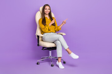 Fototapeta na wymiar Full body photo of manager sit index promo wear blouse trousers sneakers isolated on purple color background
