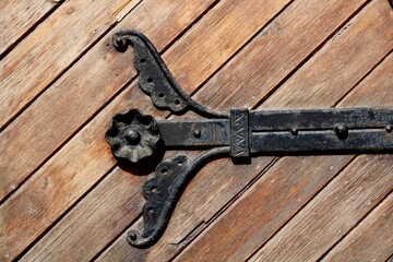 Old vintage historic church door with iron detail 