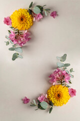 Floral composition frame, greeting card mockup. Pink and yellow flowers with copy space.