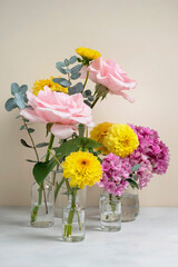 Flowers in vase with beautiful pink roses, yellow dahlia and pink hydrange bouquet. Greeting card.