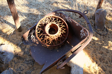 A photo/image of a very old rusty  soil scraper.