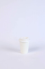one glass covered with a lid on a white background. High quality photo