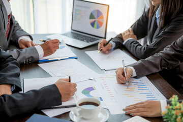 Group professional business people person working together to analyze in office, work together to discuss company financial statistics report, brainstorm ideas, and graph datum documents on the table.