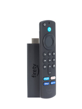 ROME, ITALY - AUGUST 18, 2022. Amazon Fire TV stick and remote 4K Max isolated on white background. Amazon is an American multinational technology company.