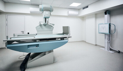 X-ray room with modern X-ray machine in hospital. Radiographic imaging room, radiology department - obrazy, fototapety, plakaty