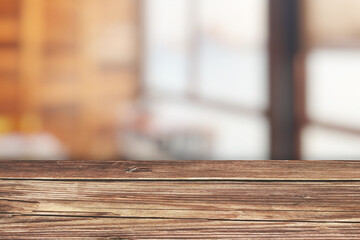 Wooden board empty table in front of blurred background. Perspective light brown wood over blur in coffee shop which can be used for display or montage your products. Mock up for display of product.