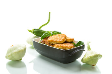 fried vegetable pancakes from squash and zucchini with herbs