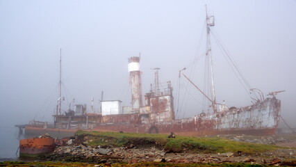 Old whaling ship in the fog, at the old whaling station in Grytviken, South Georgia Island - obrazy, fototapety, plakaty