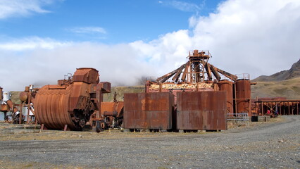 Old, rusted whale oil tanks and other industrial eqiupment at the old whaling station in Grytviken, South Georgia Island