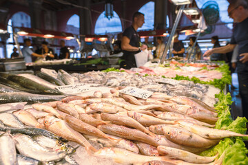 Stand with fresh fish on venetian Rialto market, Venice, Italy 