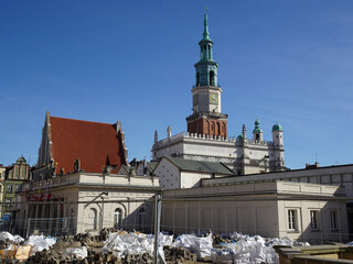 Square in Poznań during renovation works on a sunny spring day.