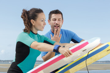 Fototapeta premium a beginner surfer with bodyboard