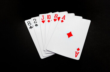 Royal playing cards on a black background.