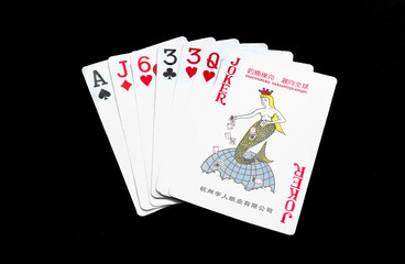 Royal playing cards on a black background.