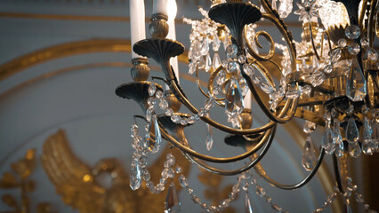 Vintage elegant led chandelier with crystals hanging in the rich interior. Closeup 