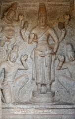 Bas relief rock cut sculptures of gods, people and animals are carved prominently in the monolithic cave temples at Mahabalipuram, Tamil nadu, India