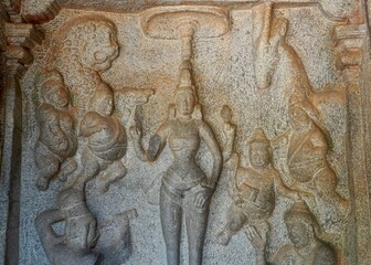 Bas relief rock cut sculptures of gods, people and animals are carved prominently in the monolithic cave temples at Mahabalipuram, Tamil nadu, India