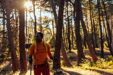 Fototapeta premium Young African American man hiking