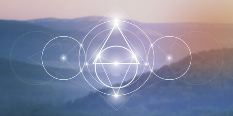 Sacred geometry spiritual new age futuristic illustration with interlocking circles, triangles and glowing particles in front of blurry natural photographic background