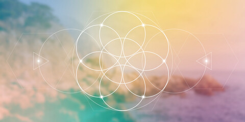 Flower of life sacred geometry spiritual new age futuristic illustration with interlocking circles, triangles and glowing particles in front of blurry natural photographic background